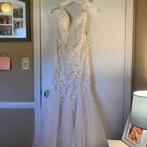 Wedding dress. Size 4. Neve worn. Ivory/champagne. $450 OBO